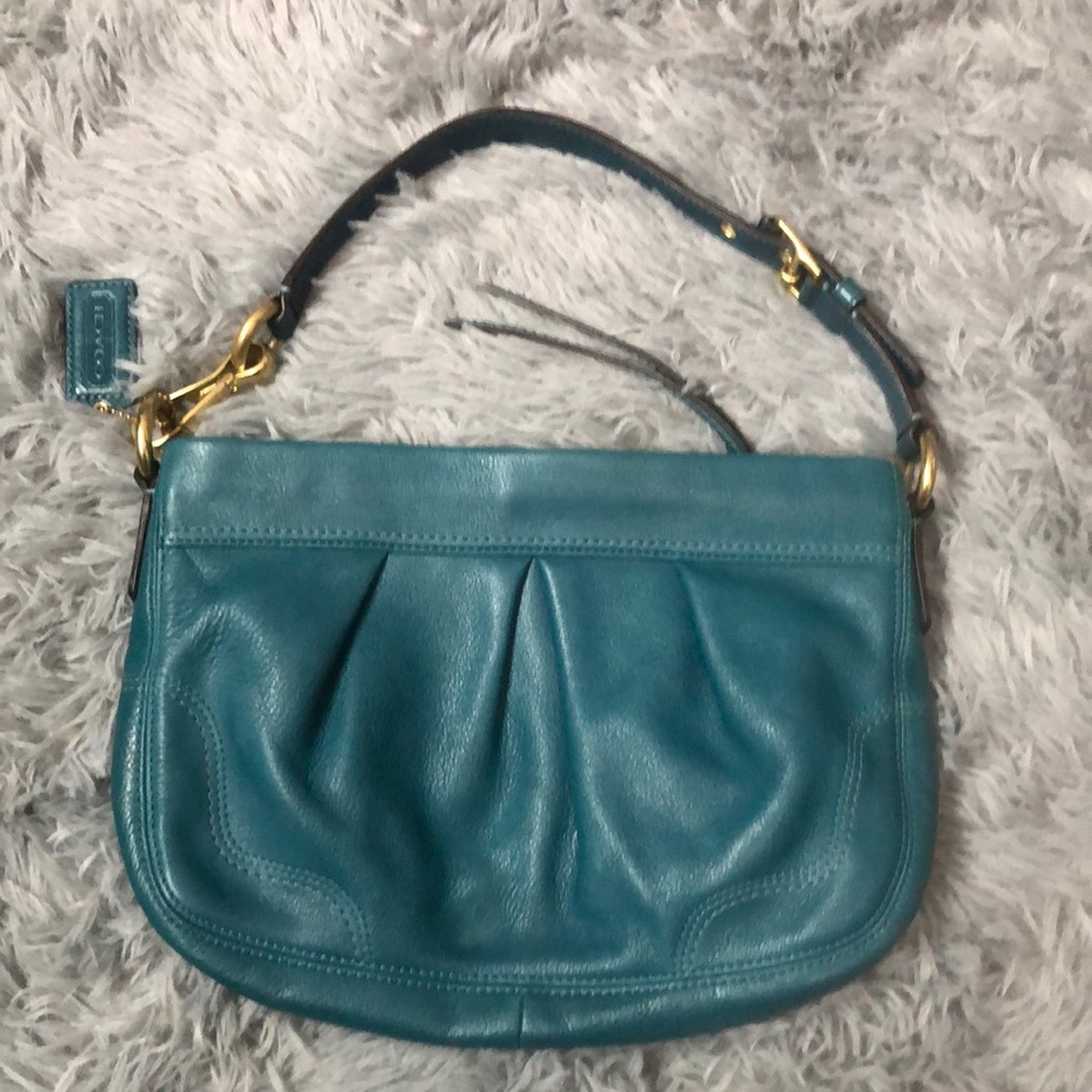 Teal Coach shoulder bag.